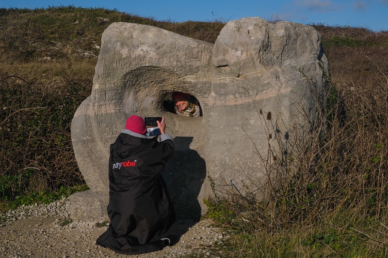 Carved stone sculptures among the rock faces of Tout Quarry Sculpture Park